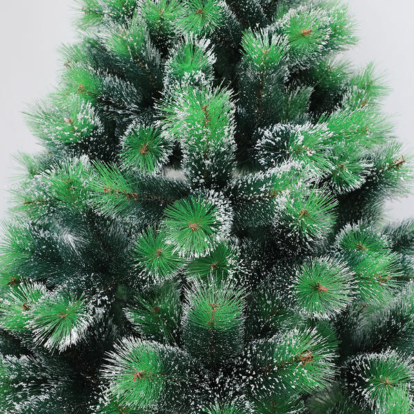 Two green pine neddles artificial Christmas tree snowy